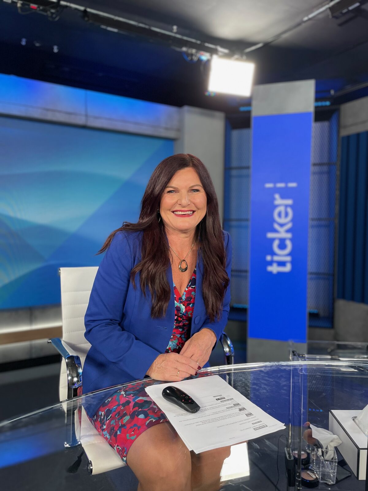 Annie Gibbins on Ticker News broadcast studio set